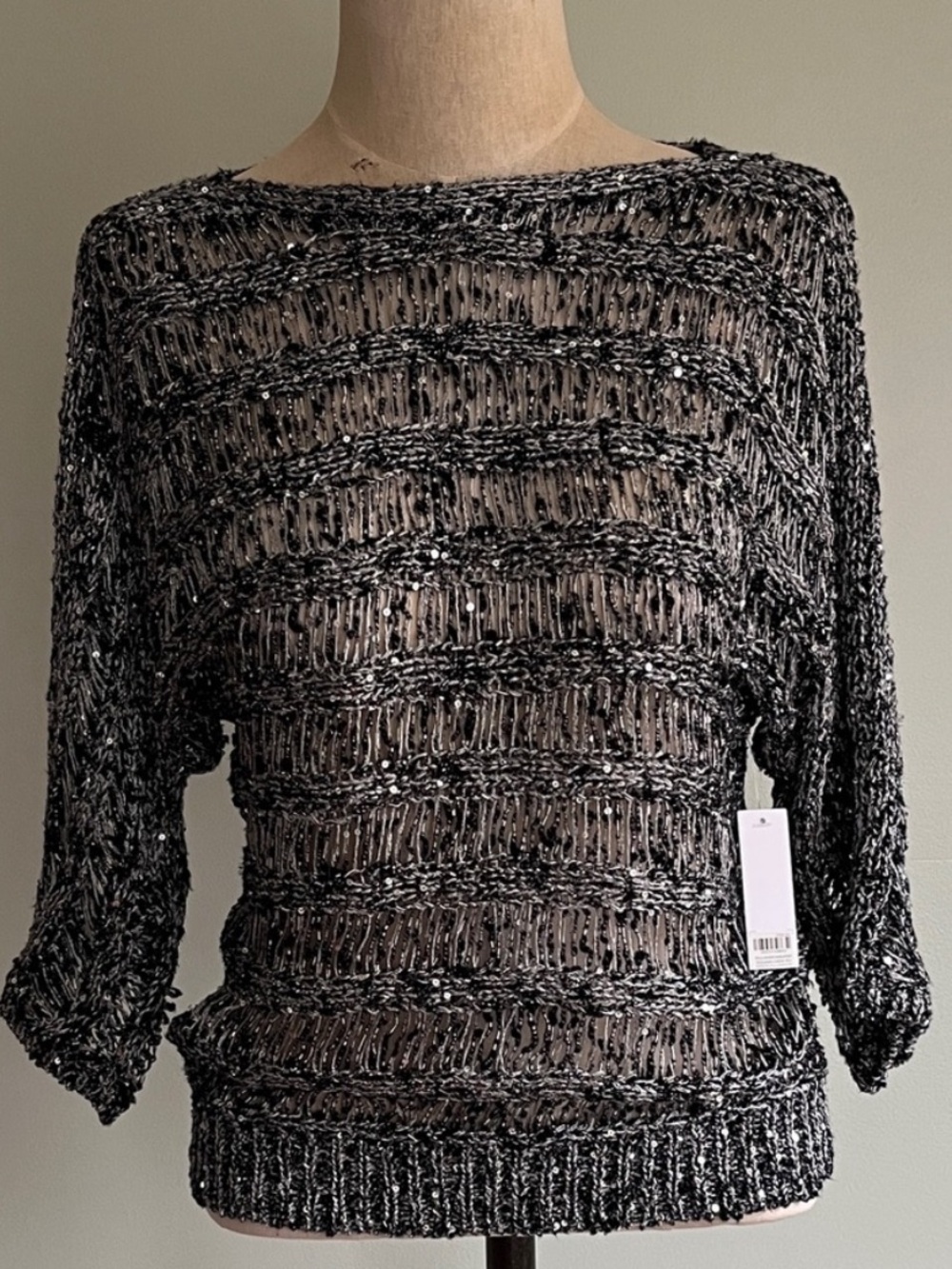 Chico’s Black and Silver Shimmer Knit Sweater
Size 4